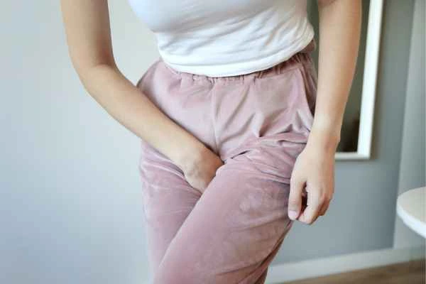 woman running for the toilet because of urinary incontinence Cranleigh